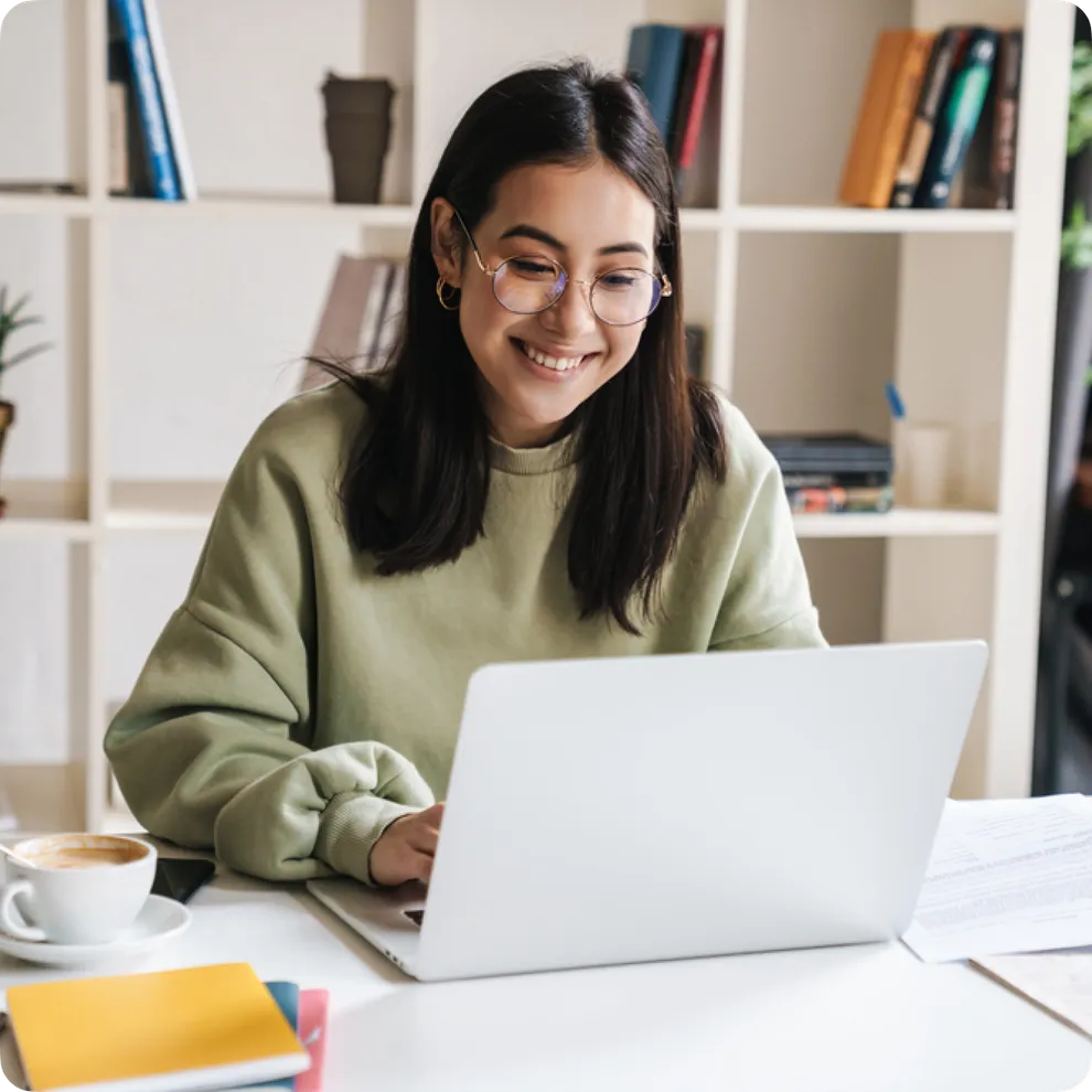 Girl-smiling-at-laptop